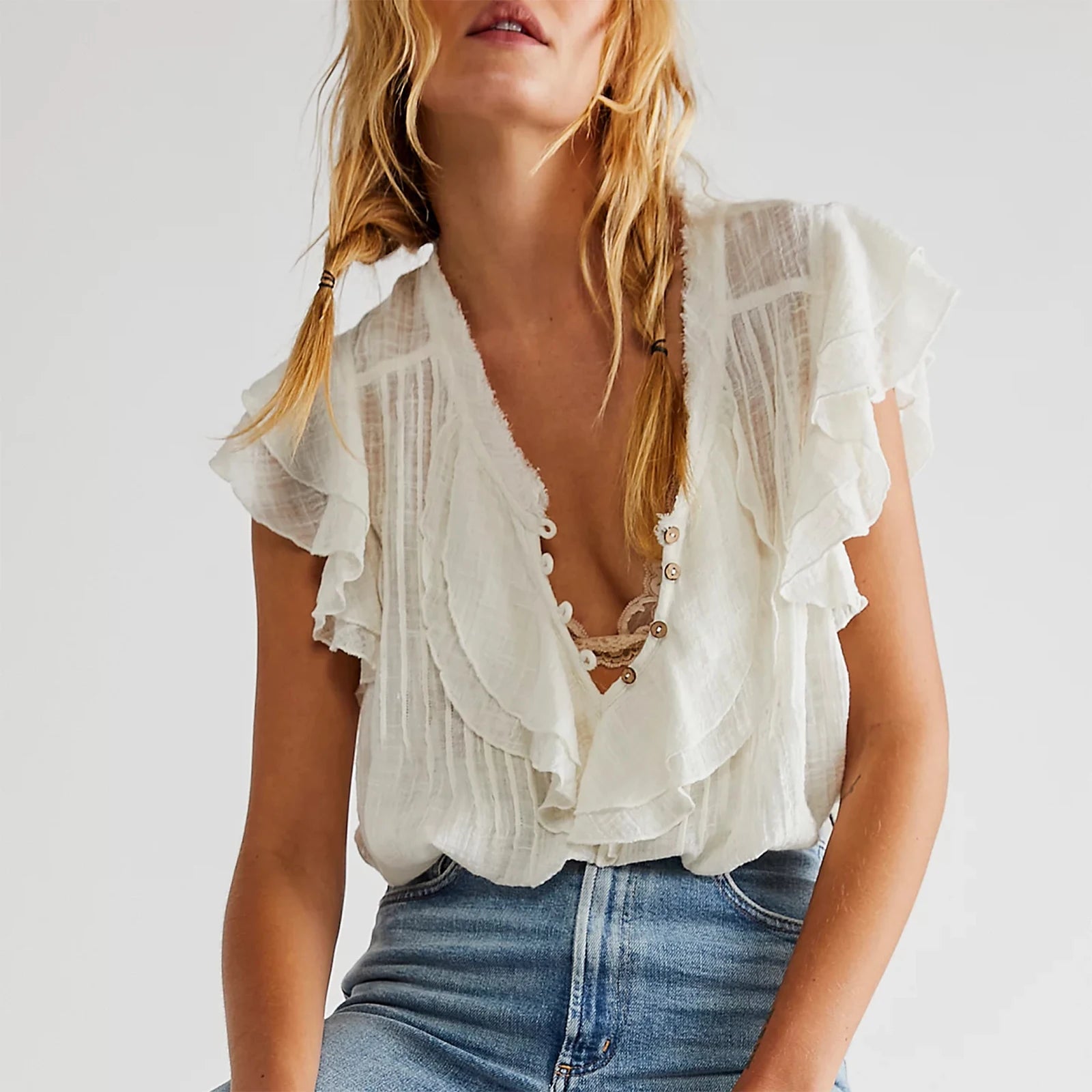 Women's white summer blouse top with ruffle details, perfect for casual outings