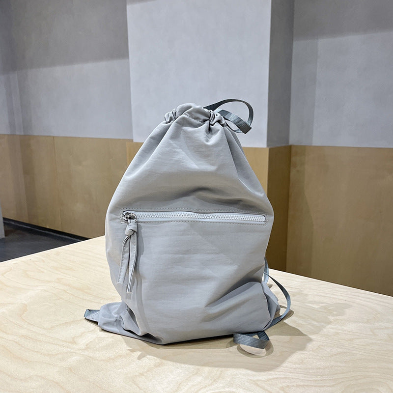 Stylish SHOMICOBOUTIQUE women's summer bucket bag in light gray with drawstring and zippered pocket