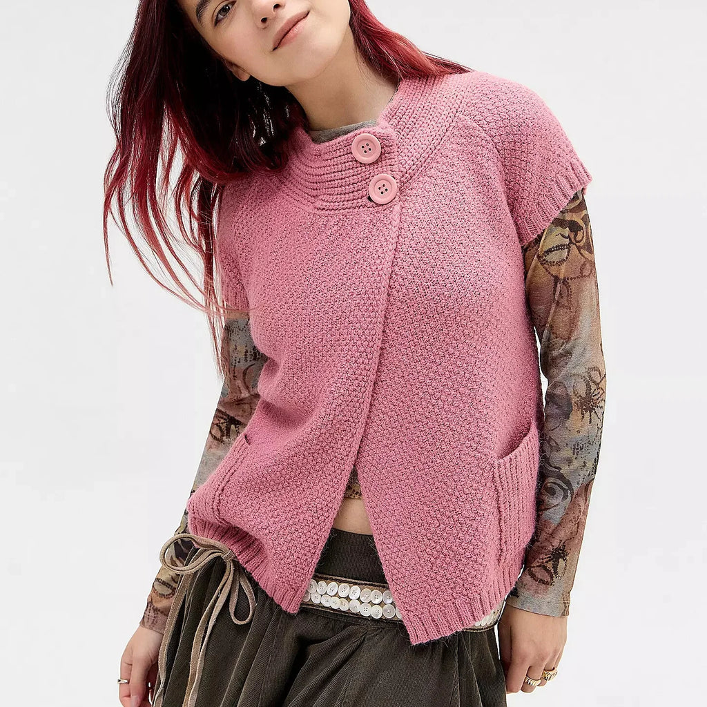 Women's pink knitted sweater with buttons, perfect for casual outings.