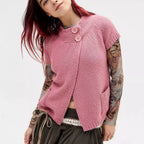 Women's pink knitted sweater with buttons, perfect for casual outings.