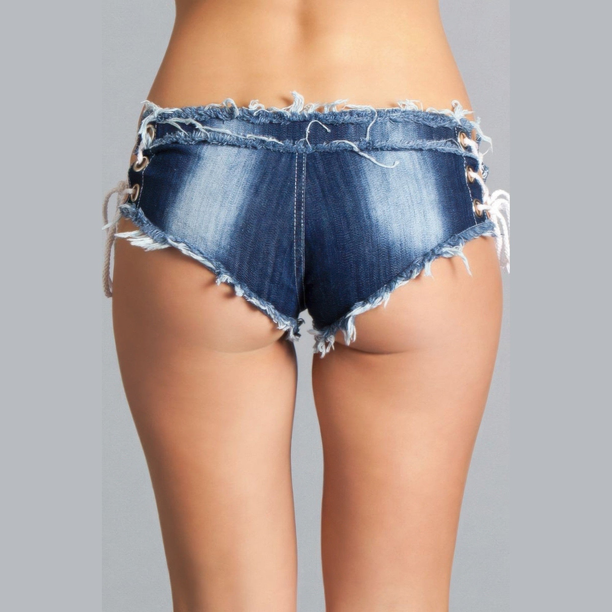 Stylish womens vacation shorts in denim with lace-up sides and frayed hem for a trendy beach look