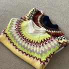 Two women's vintage pattern sweaters in colorful designs, perfect for stylish layering in cooler weather