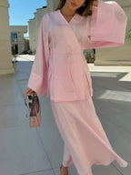 Pink wrap skirt and matching top set, perfect for summer outings