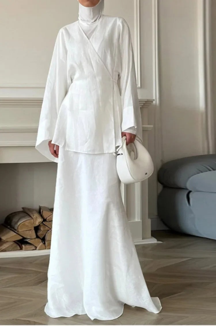 Women's white wrap skirt in lightweight fabric, perfect for elegant occasions