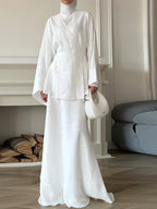 White wrap skirt made of lightweight linen, perfect for summer outings