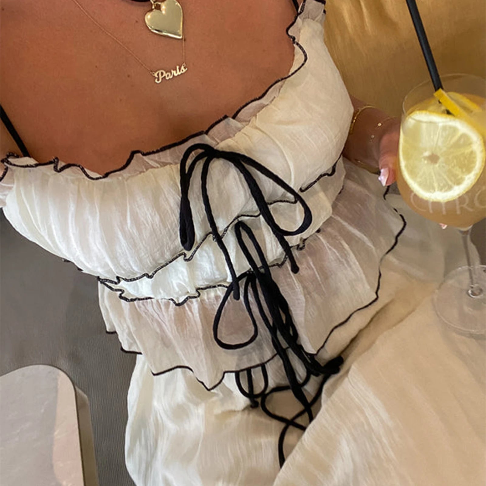 Women's sheer white y2k outfits with black ties, perfect for summer events