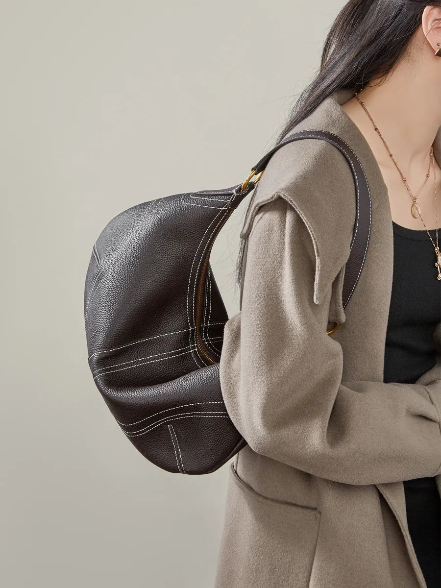 Women's leather crossbody mini bag in dark brown, perfect for everyday use