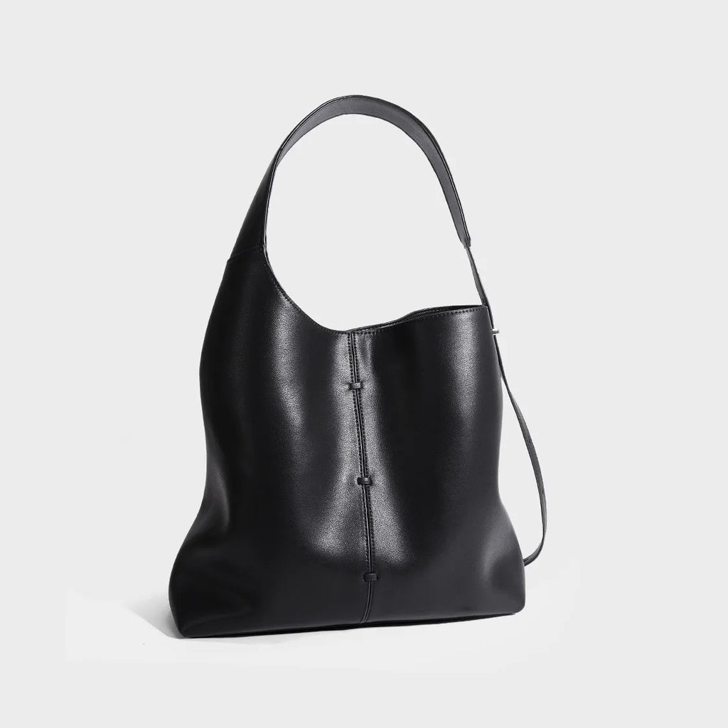 Black leather tote bag, stylish and versatile for daily use