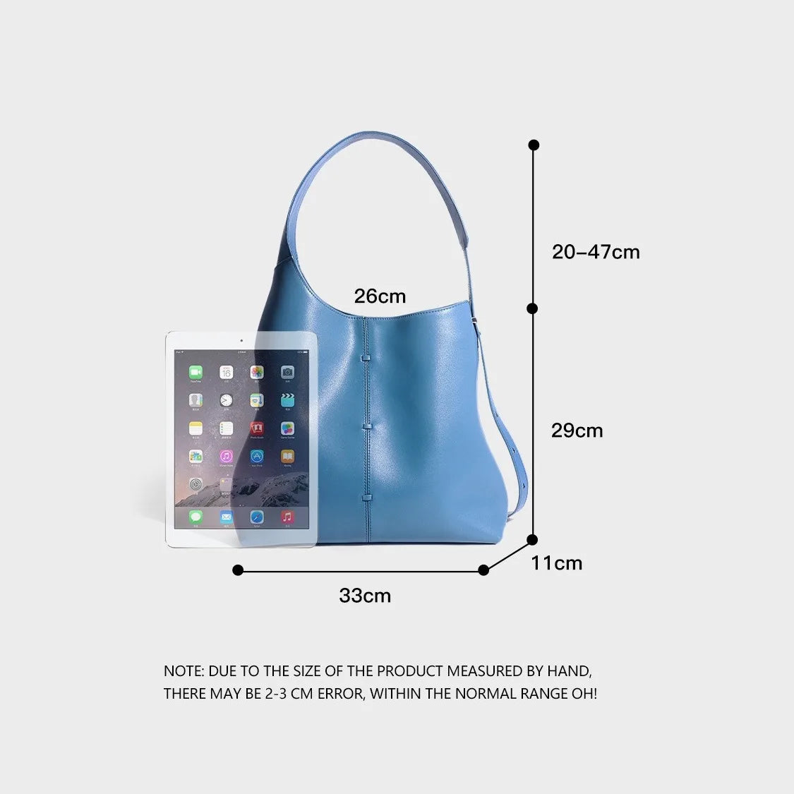 Blue leather tote bag for daily travel with adjustable straps
