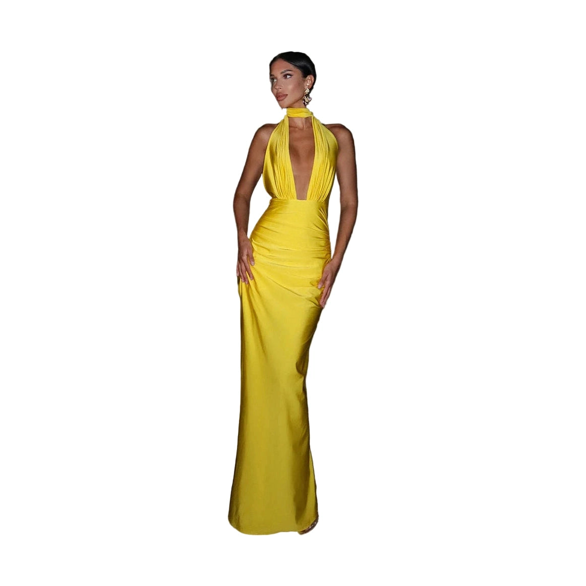 Woman wearing a yellow halter deep v neck maxi dress standing outdoors at night