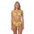 Beach Joy yellow island print bikini set with floral design and adjustable straps on model