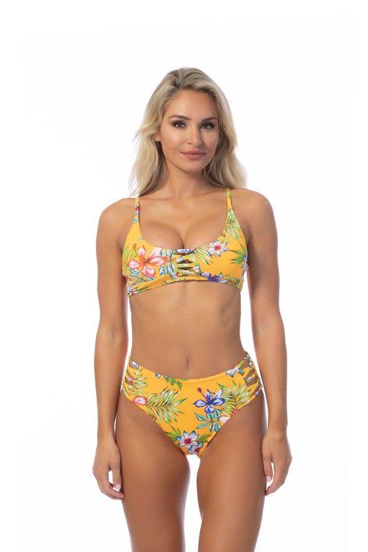 Beach Joy yellow island print bikini set with floral design and adjustable straps on model