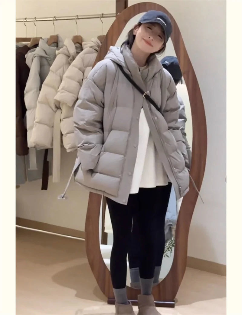 Women's light gray hooded puffer jacket, perfect for winter wear