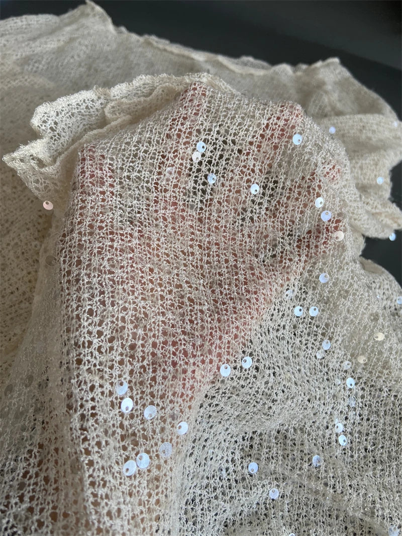 Women's sequin top in off-white, perfect for festive occasions