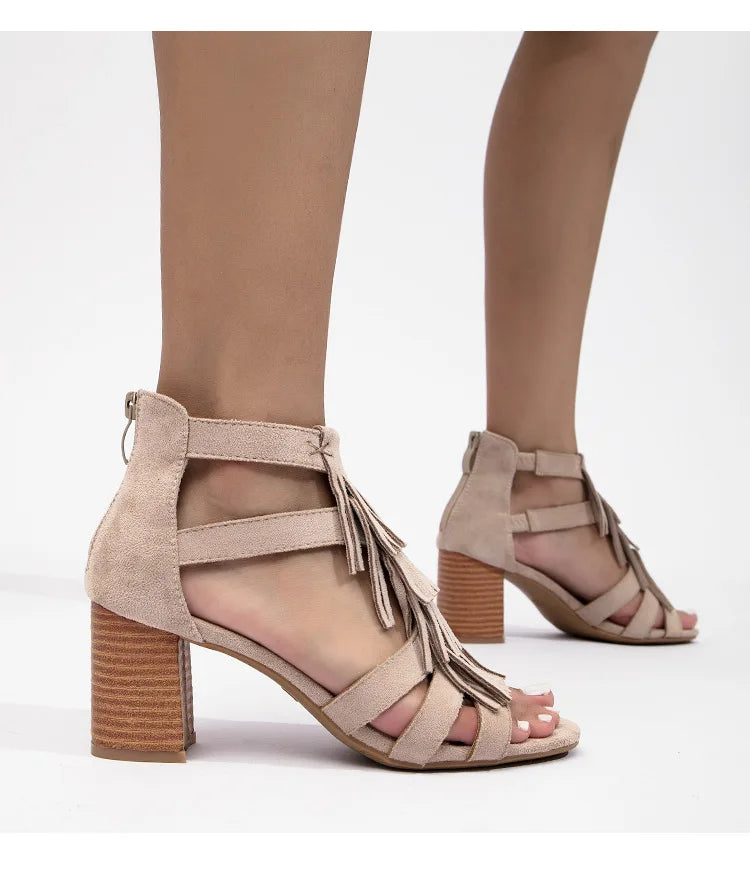 Women's tan suede sandals with fringe, vacation worthy heels