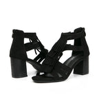 Women's black suede sandals with fringe, vacation worthy footwear