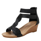 Women's black wedge sandals with stylish woven straps for casual outings