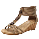 Women's tan wedge sandals with decorative detailing, perfect for summer outings