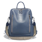 Blue leather travel bag with stylish braided strap for easy carrying