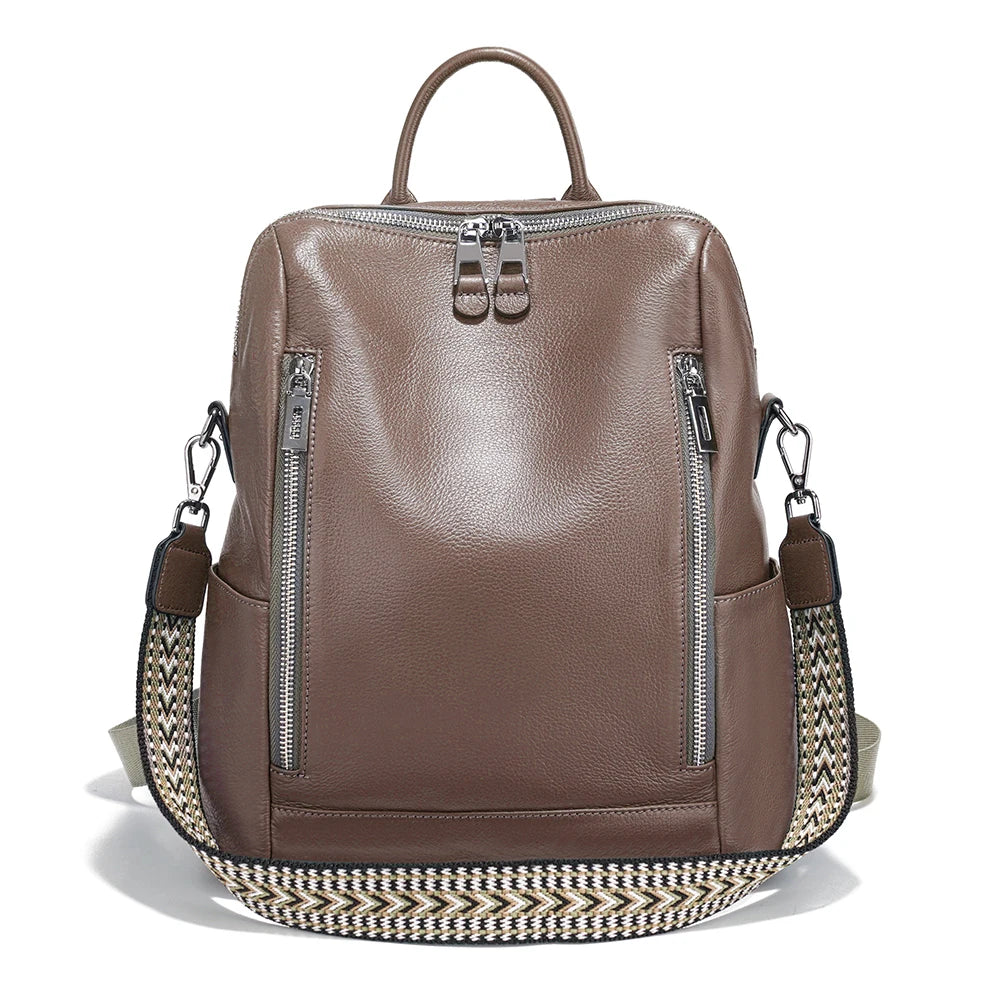 Brown leather travel bag with woven strap for versatile use