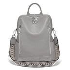Gray leather travel bag with patterned side panel and dual zippers