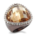AAA studded brass fashion ring with a large faceted center stone and sparkling embellishments