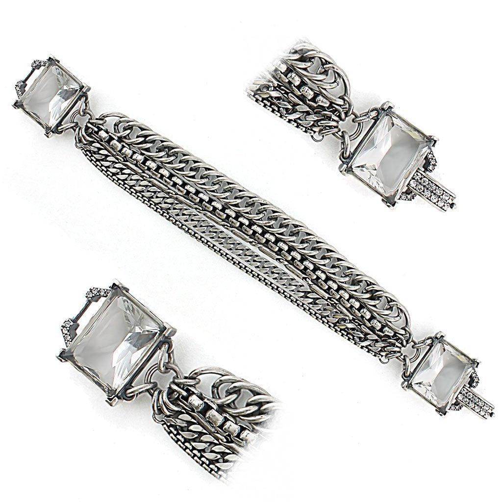 Elegant antique brass jewelry for women featuring a unique chain bracelet with sparkling stones