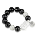 Antique silver white metal bracelet featuring black beads and a Buddha charm for a unique jewelry piece