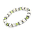 Elegant antique silver women's bracelet with white pearls and green beads for a chic look