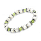 Elegant antique silver women's bracelet with white pearls and green beads for a chic look