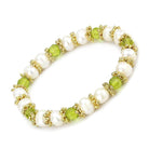 Unique antique silver women's bracelet adorned with pearls and green gemstones