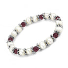 Elegant antique silver women's bracelet with pearls and red gemstones for a stylish accessory
