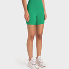 Trendsi high-rise biking shorts in vibrant green for comfortable workouts and cycling activities