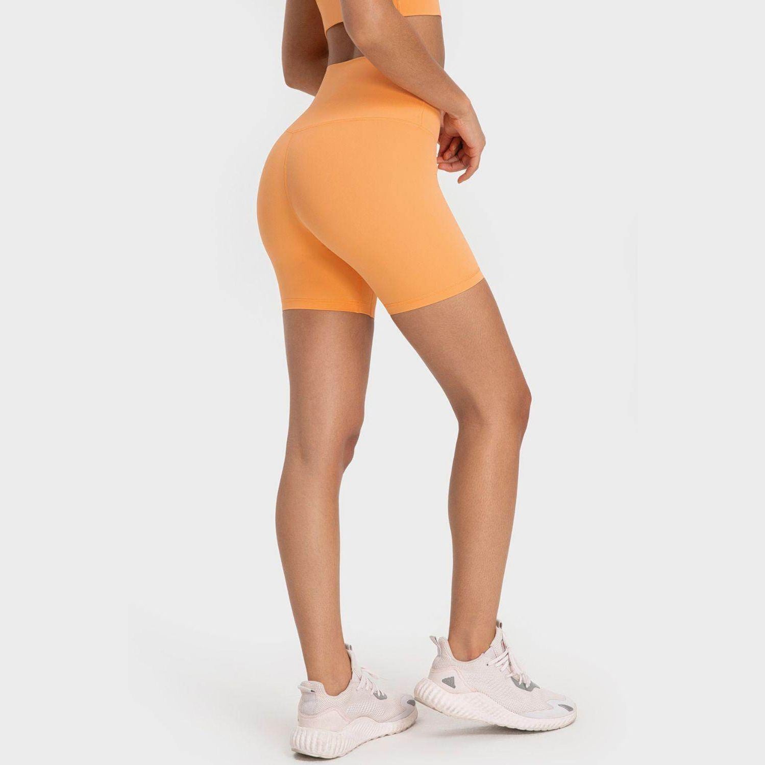 Trendsi high-rise biking shorts in vibrant orange, perfect for workouts and casual wear