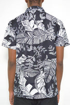 Men's black and white button down for men featuring a tropical leaf pattern on the back