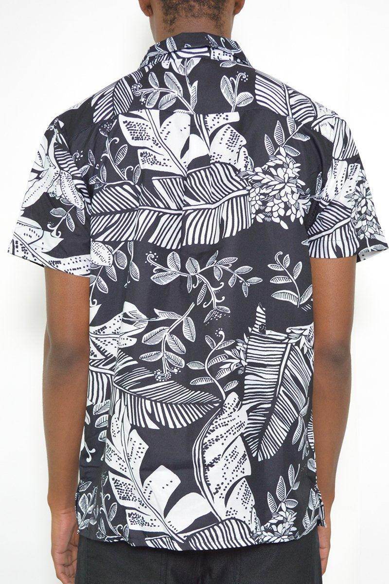 Men's black and white button down for men featuring a tropical leaf pattern on the back