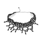 Elegant black beaded choker necklace with intricate netted design and dangling beads