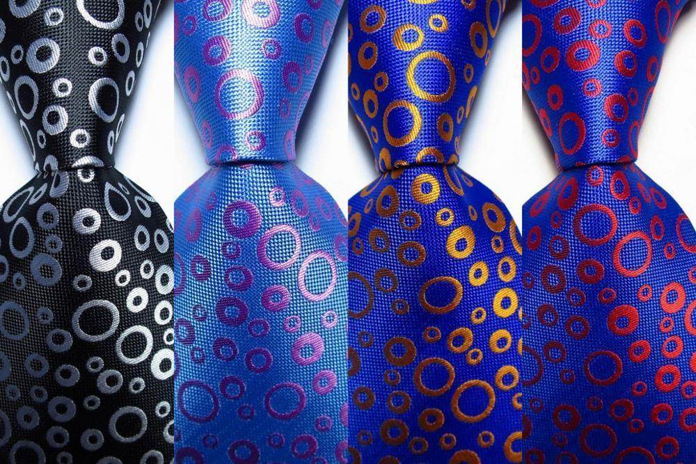 VacationGrabs black orange dot tie featuring a unique pattern for stylish formal wear