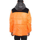 Back view of a vibrant orange men's jacket with a black suede down jacket collar from VacationGrabs