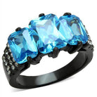 Stunning blue gemstone cocktail ring featuring three large blue stones with sparkling accents