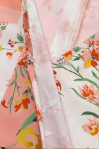 Close-up of VacationGrabs boho pink floral wrap shirt featuring vibrant floral patterns and button detail
