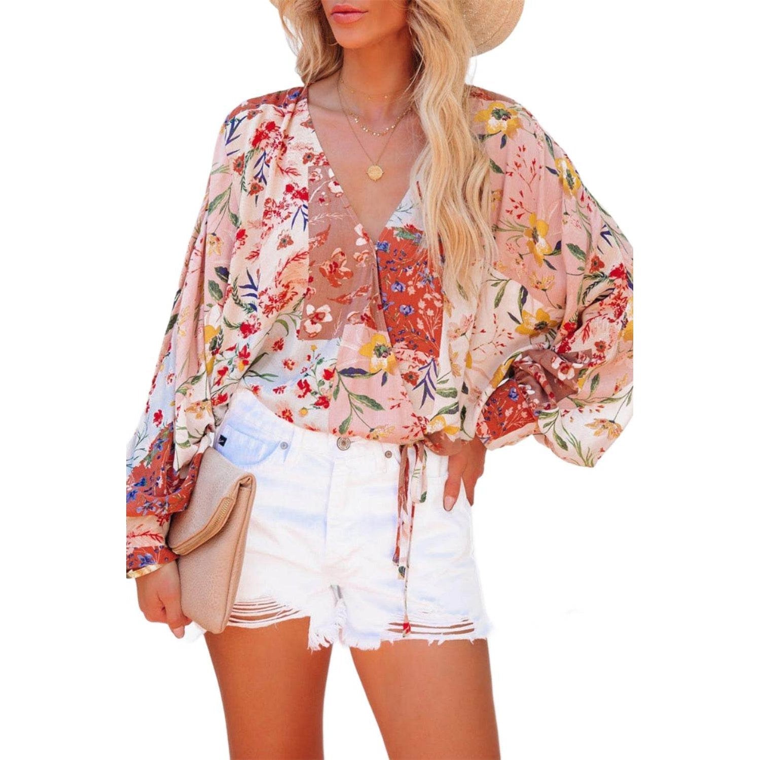 VacationGrabs boho pink floral wrap shirt featuring a colorful floral print and flowy sleeves
