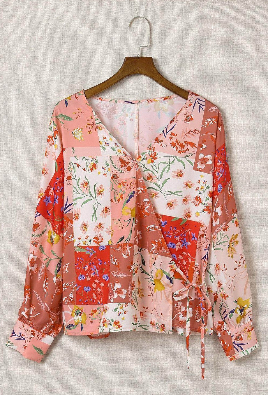 Boho pink floral wrap shirt featuring vibrant floral prints and a stylish tie detail