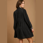 Stylish black boho vacation dress with long sleeves and tiered design from VacationGrabs