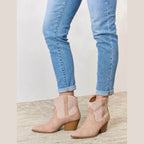 Women's tan ankle booties with decorative stitching for stylish outfits