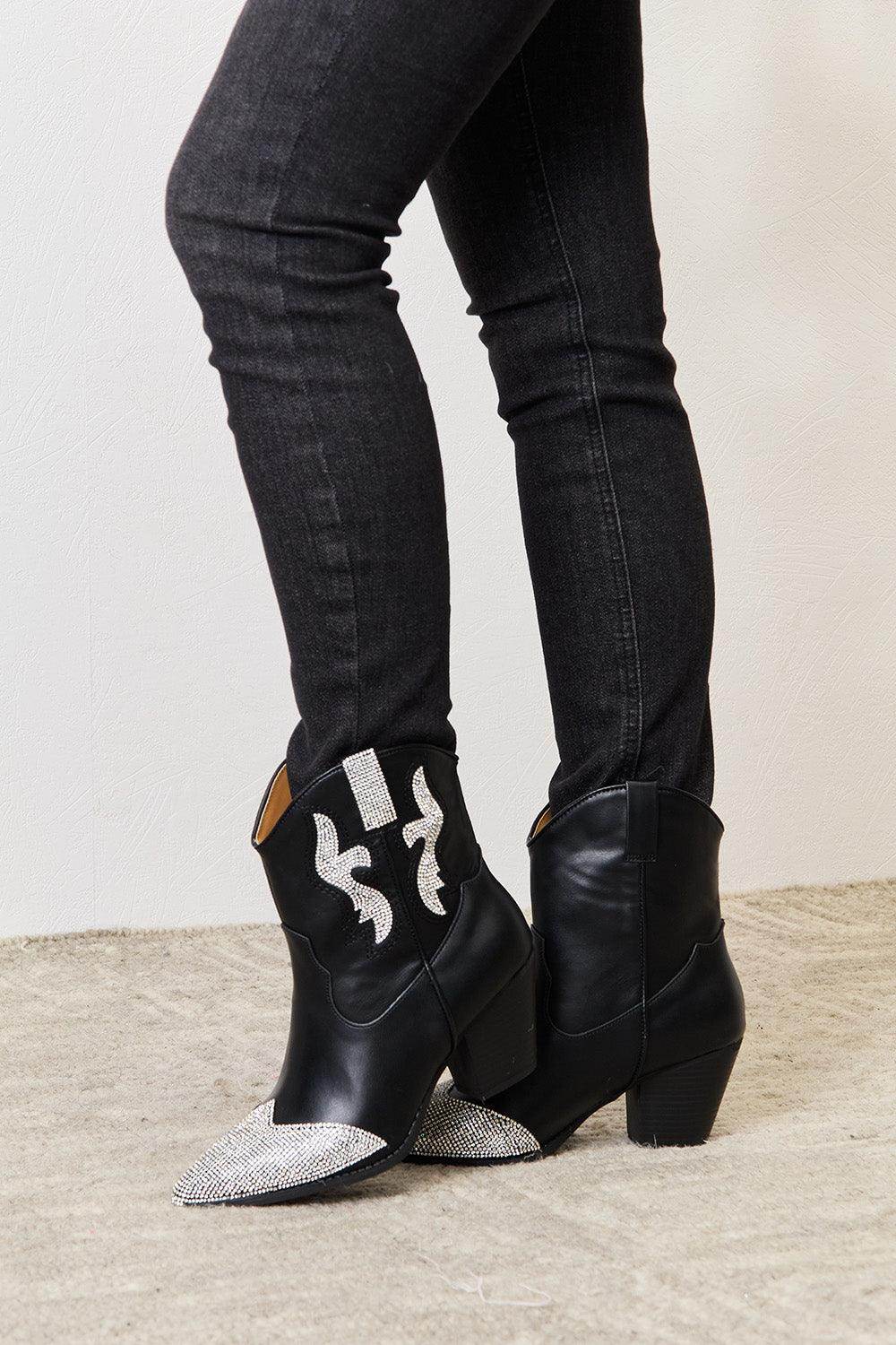 Women's black pointed toe boots with rhinestone accents for trendy style