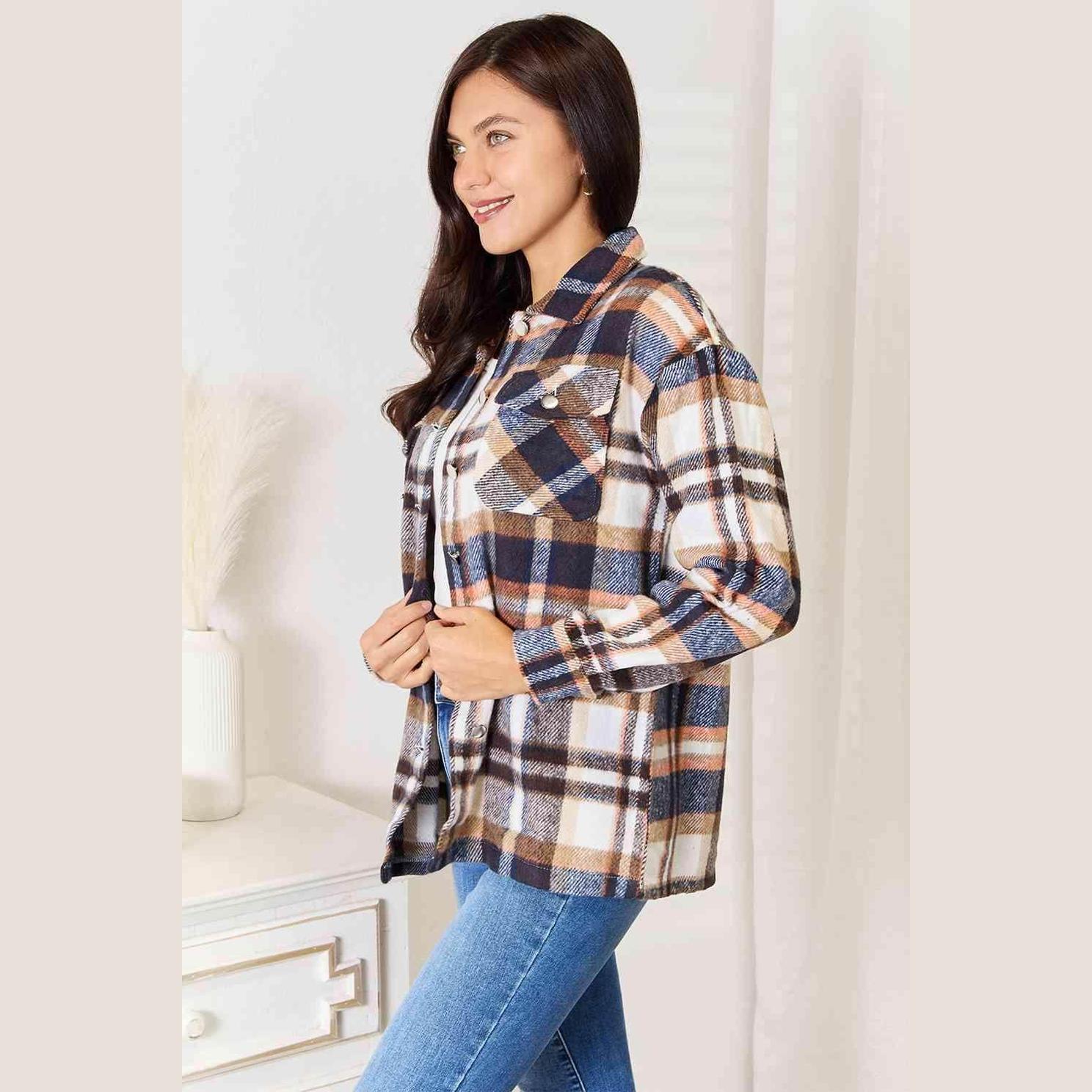 Stylish women's button front plaid shacket in blue and orange tones for casual wear