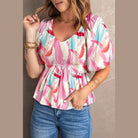 Colorful women's casual beachwear blouse with puff sleeves and a flattering fit
