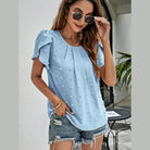 Trendsi casual pink Swiss dot top featuring short ruffled sleeves and a comfortable fit
