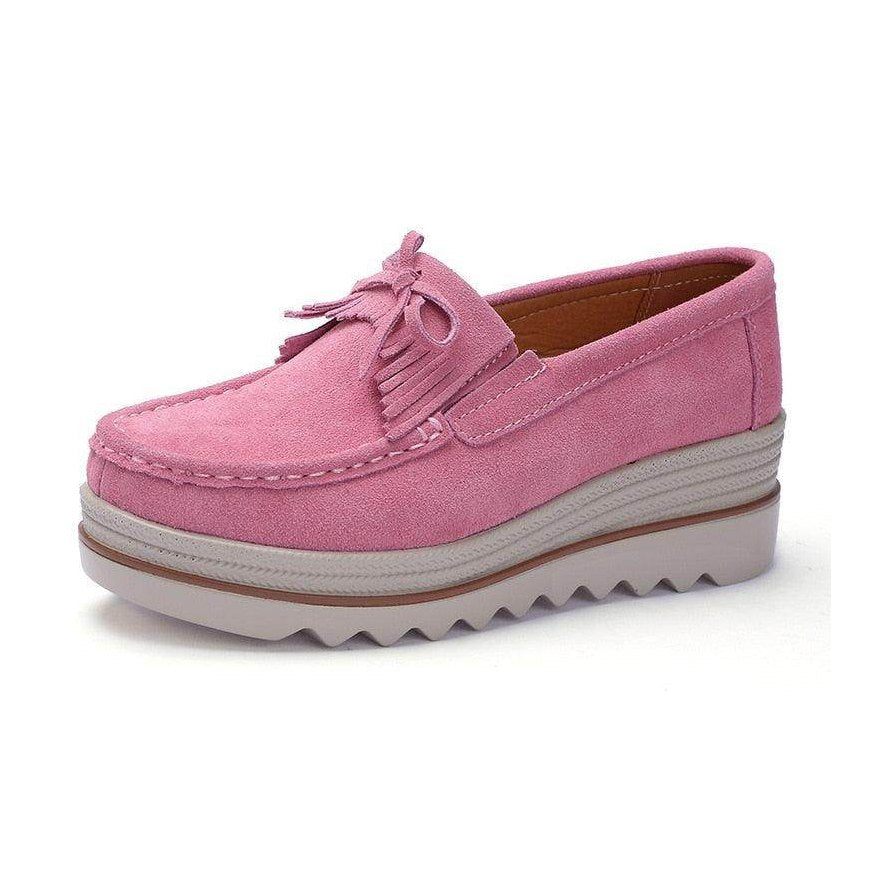Pink VacationGrabs colorful platform shoes with fringe detail and a comfortable sole